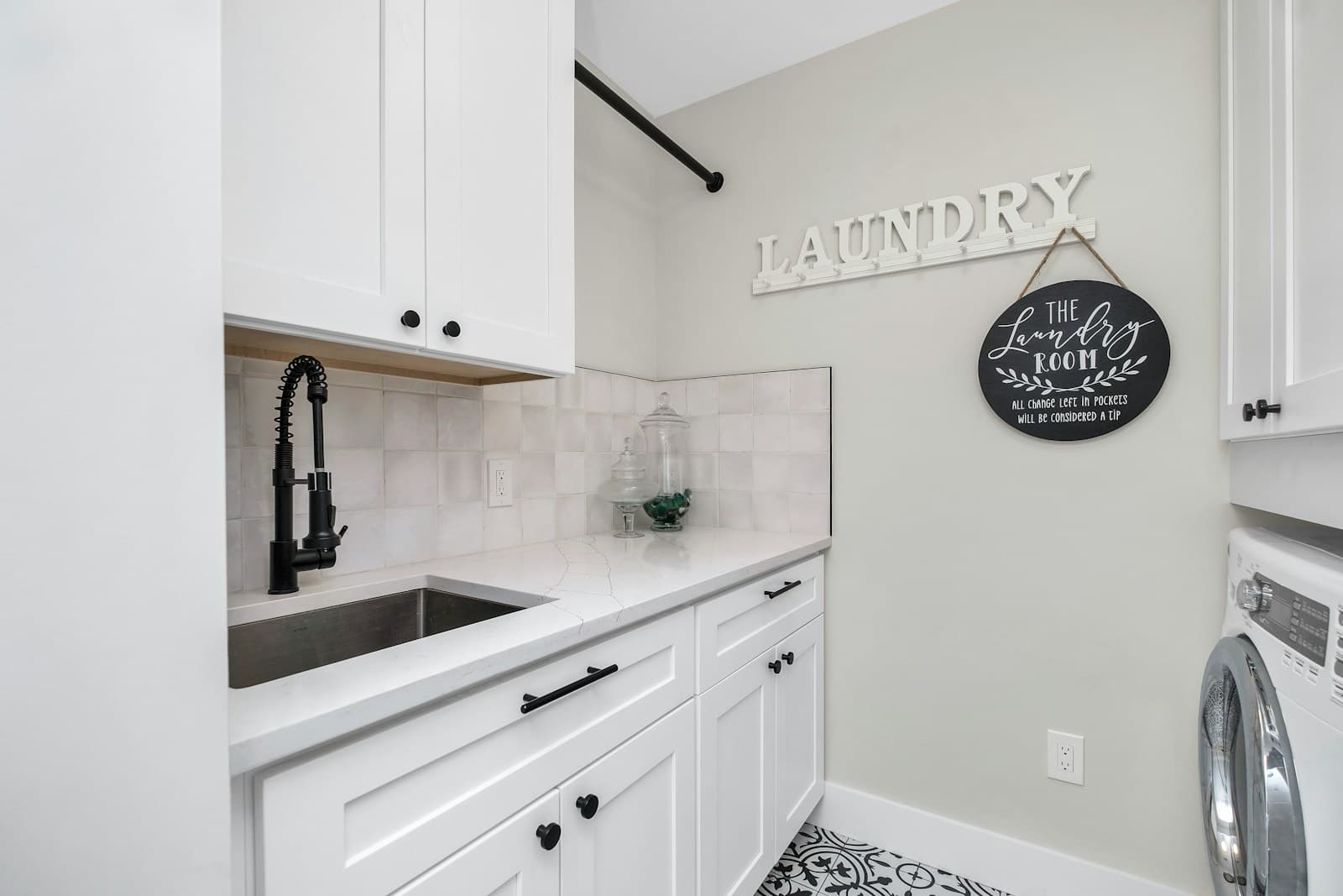 White sink cabinetry with a generous work surface