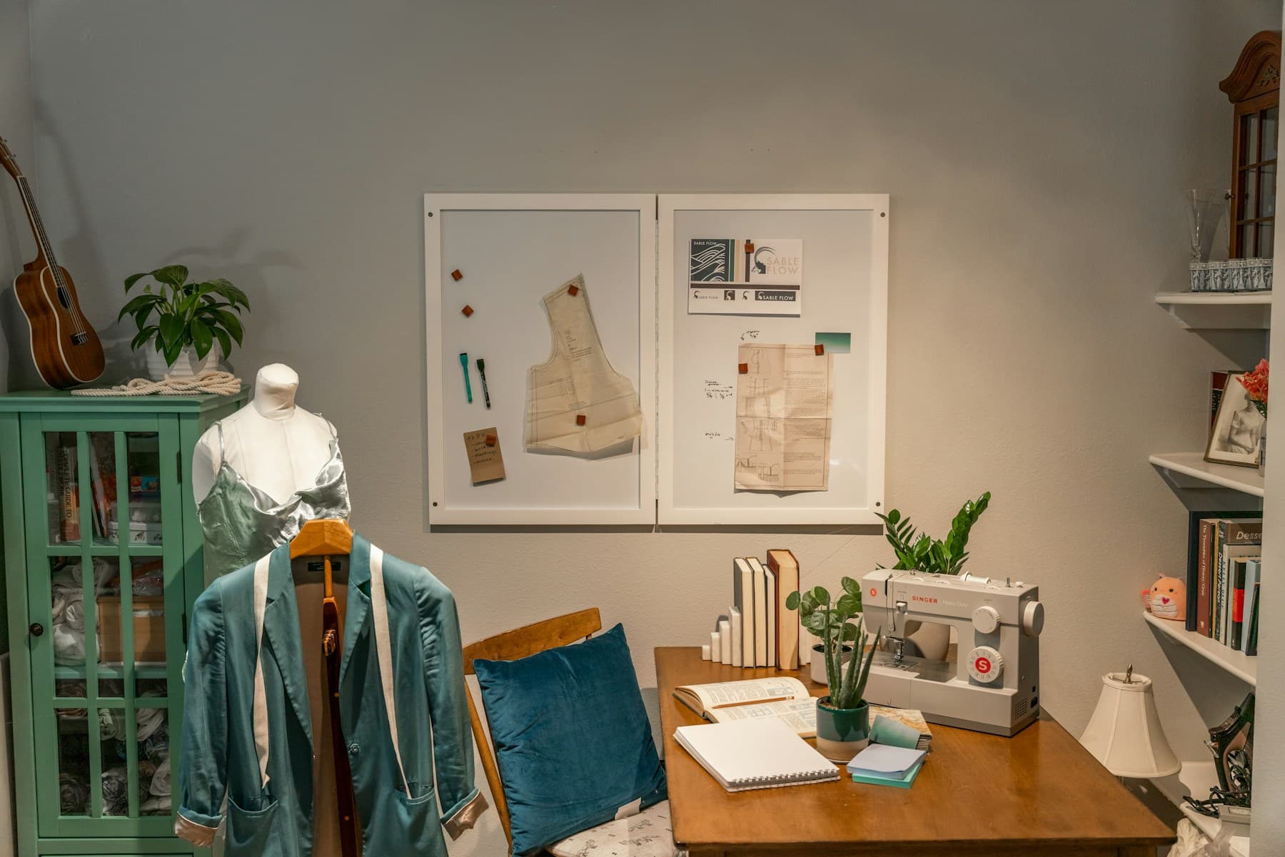 Craft room with a sewing table and storage cabinetry