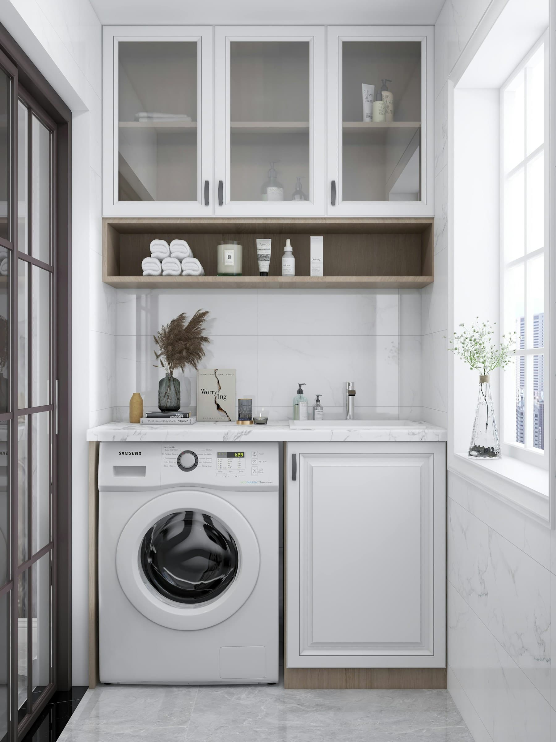 Laundry room with cabinets above the washer and dryer