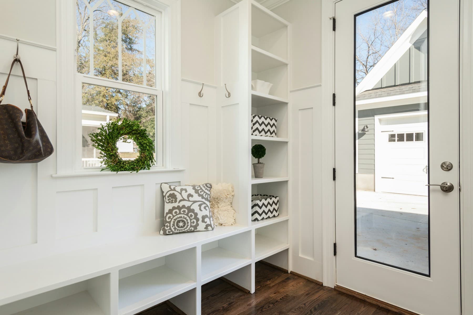 Mudroom with a bench, hooks and built-in cubbies